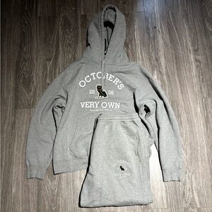 Ovo sweater and jogging pants.